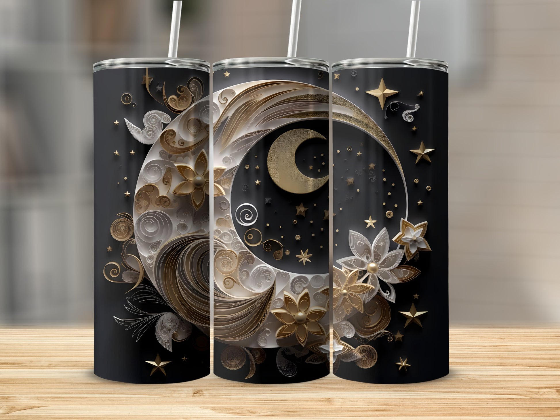 Three black tumblers with ornate gold celestial moon and star designs.