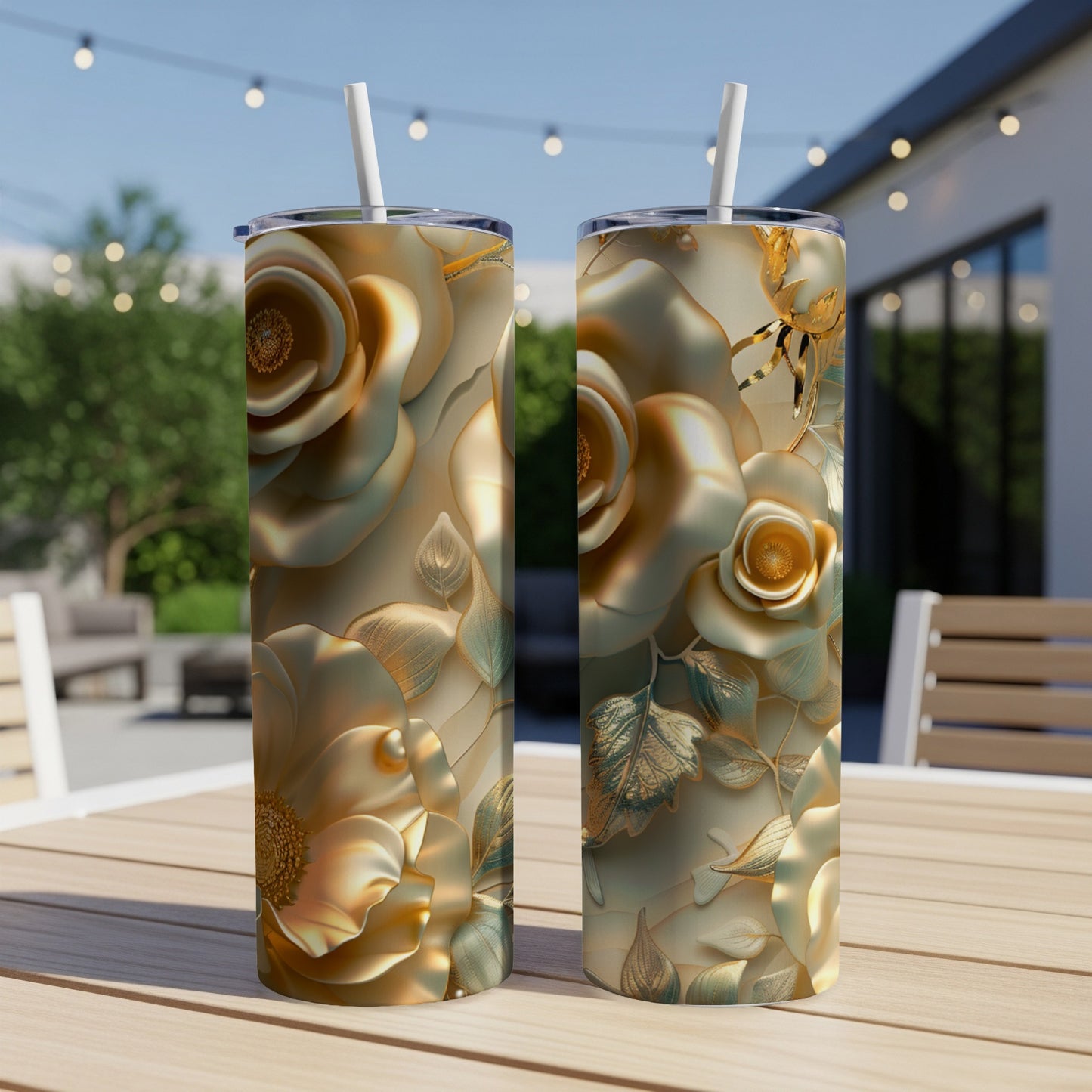 Two decorative tumblers featuring embossed golden roses and leaves on a table.
