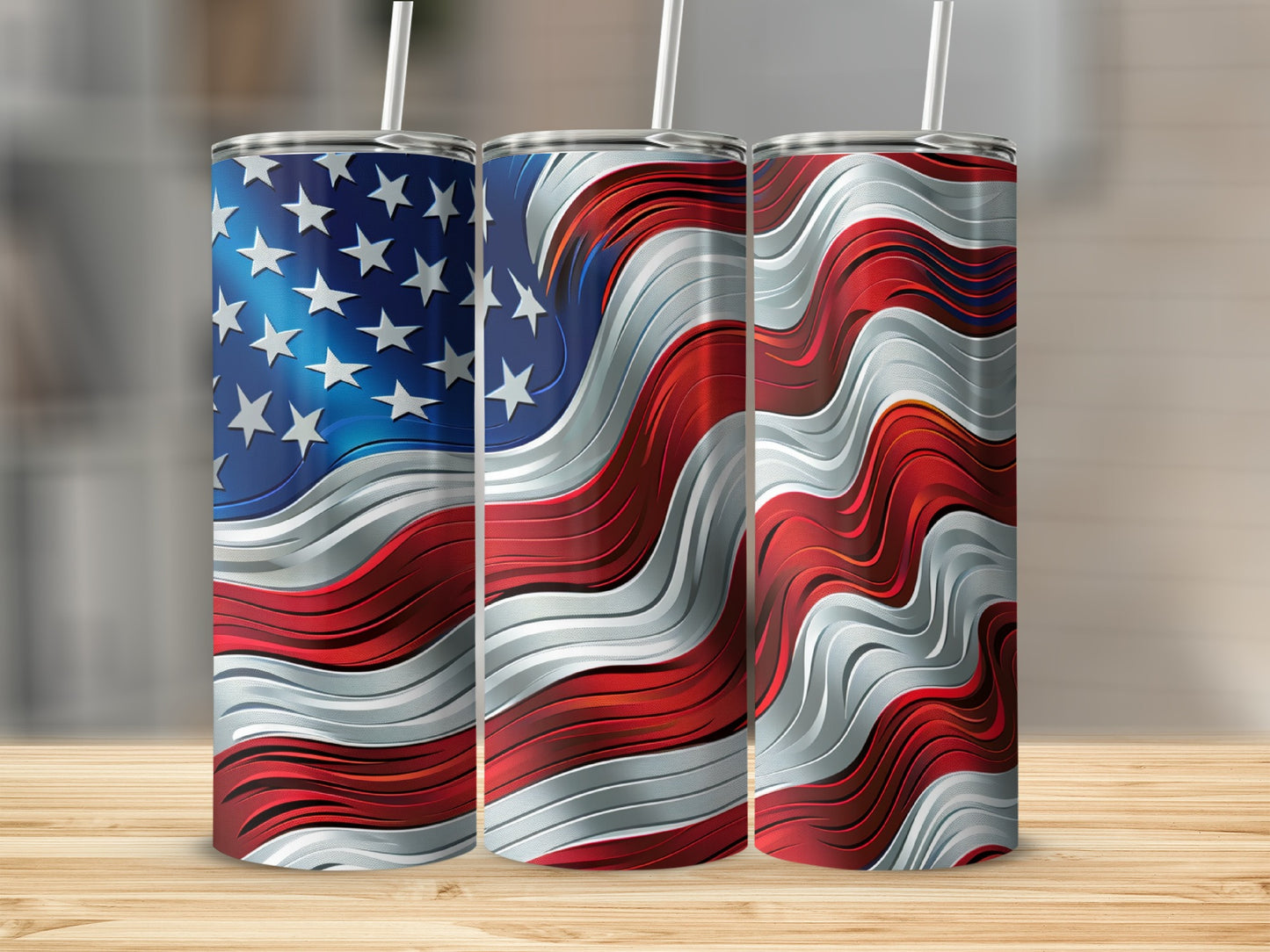 Three stainless steel tumblers with wavy American flag design.