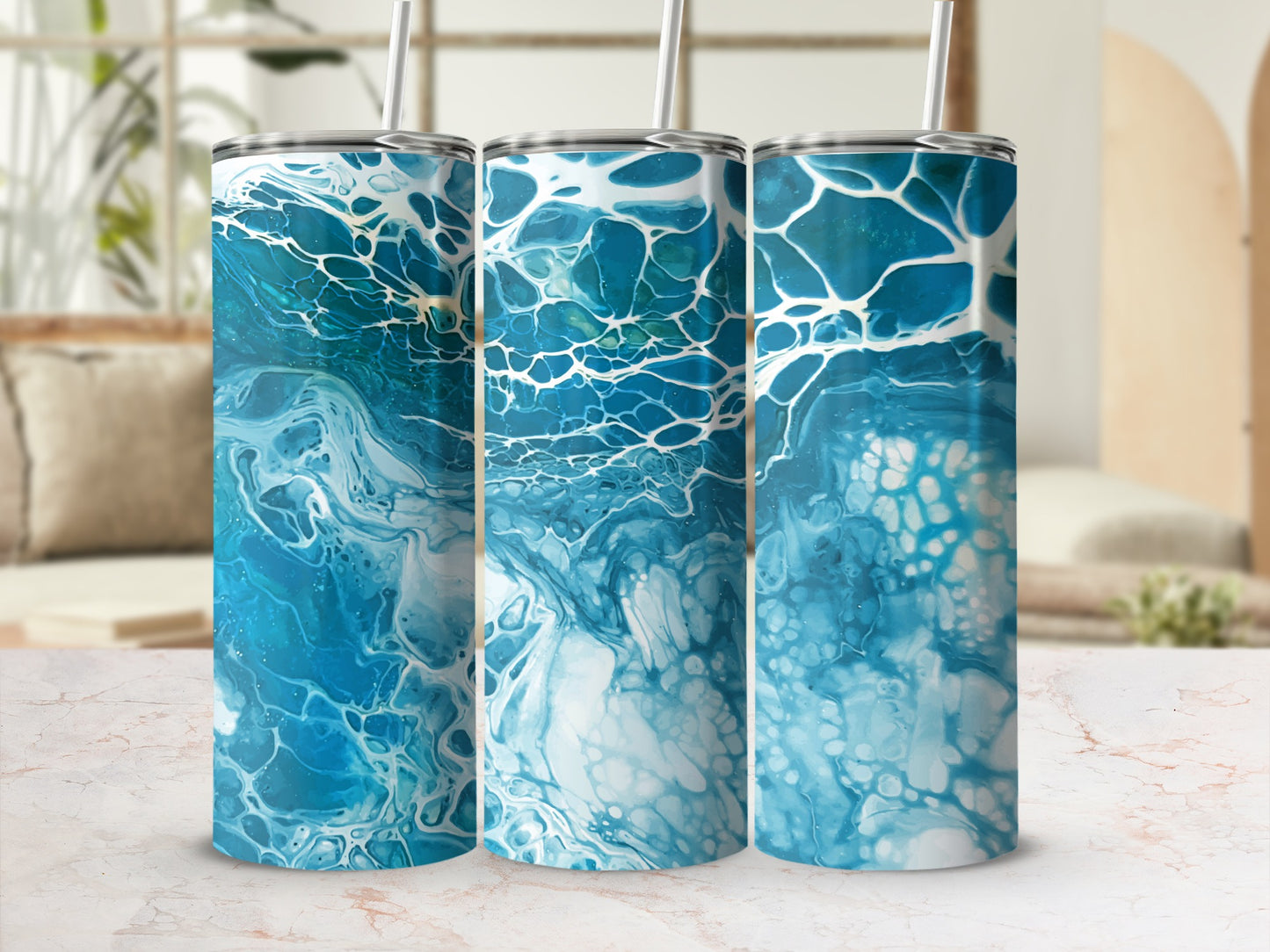 Three tumblers with abstract blue and white paint pour design