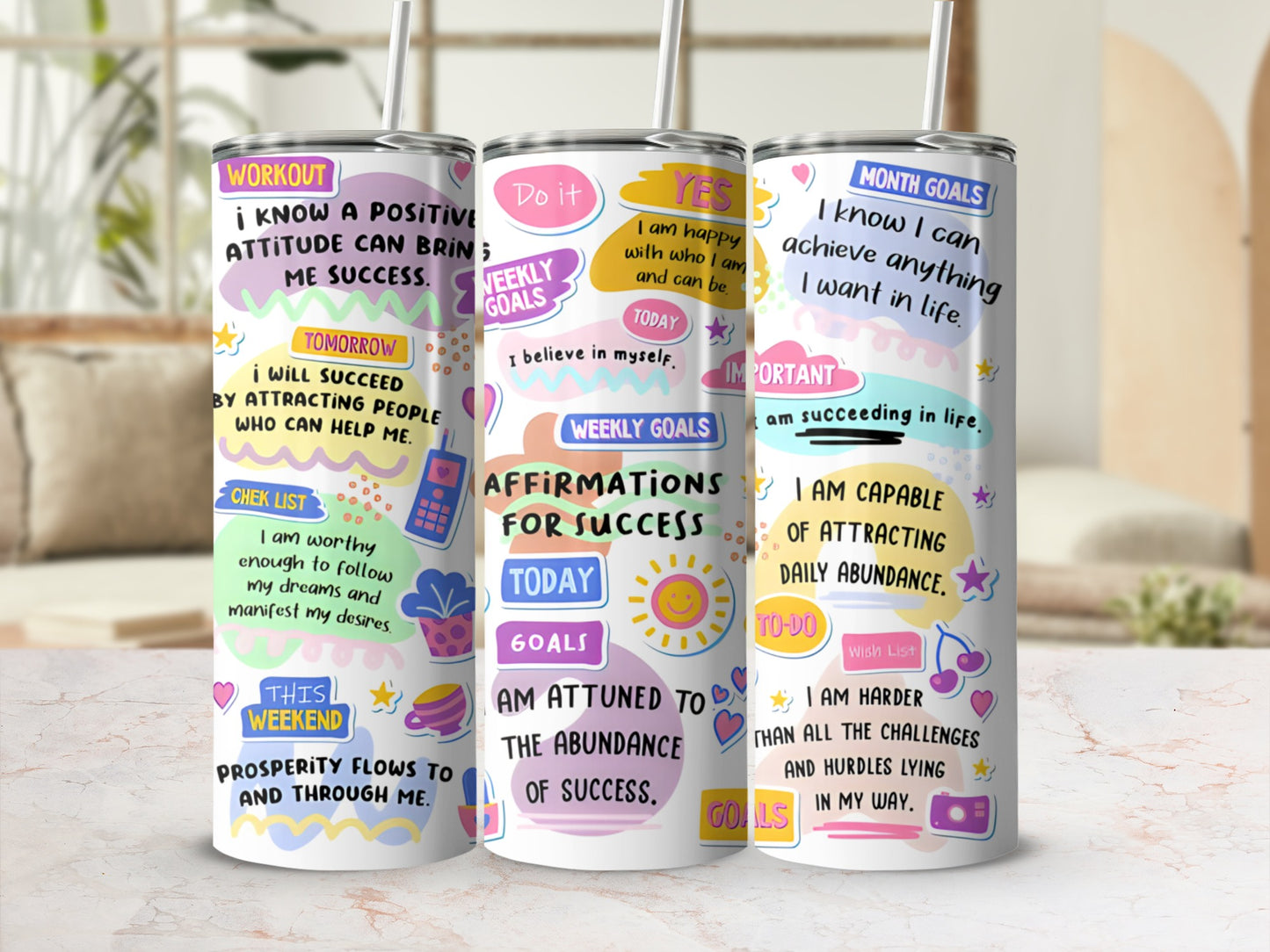 Three motivational tumblers with positive affirmations and colorful designs.