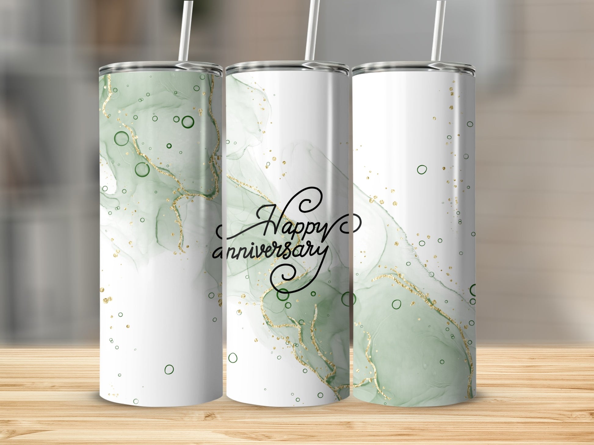 Three tumblers with a green marble and gold glitter design, reading "Happy Anniversary".