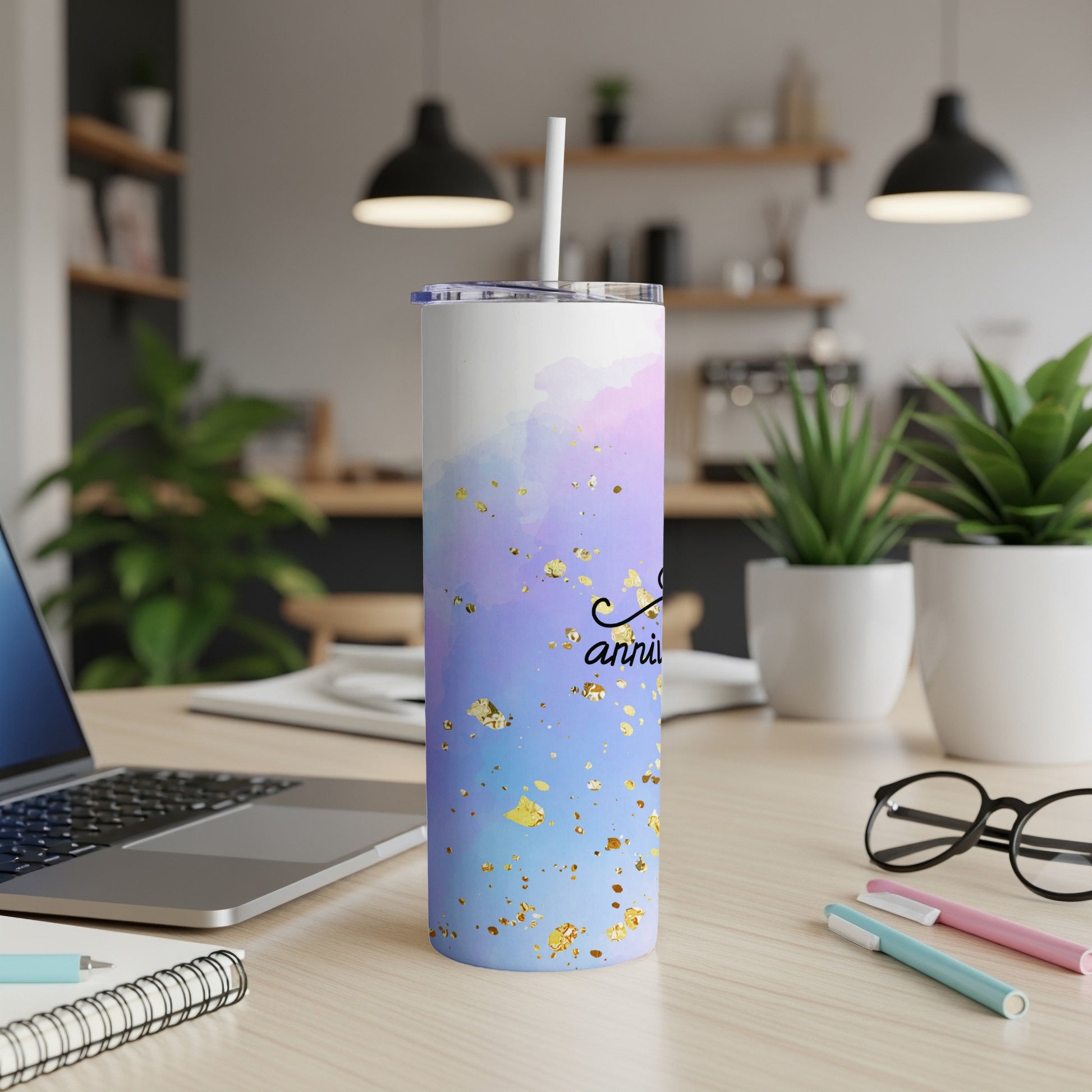 White tumbler with purple and blue watercolor design and gold foil accents.