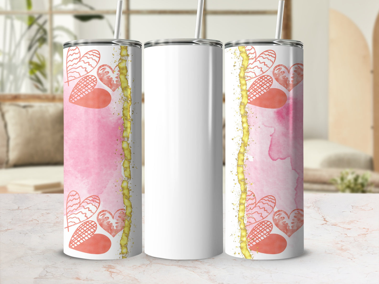 White tumbler with pink watercolor and heart design.