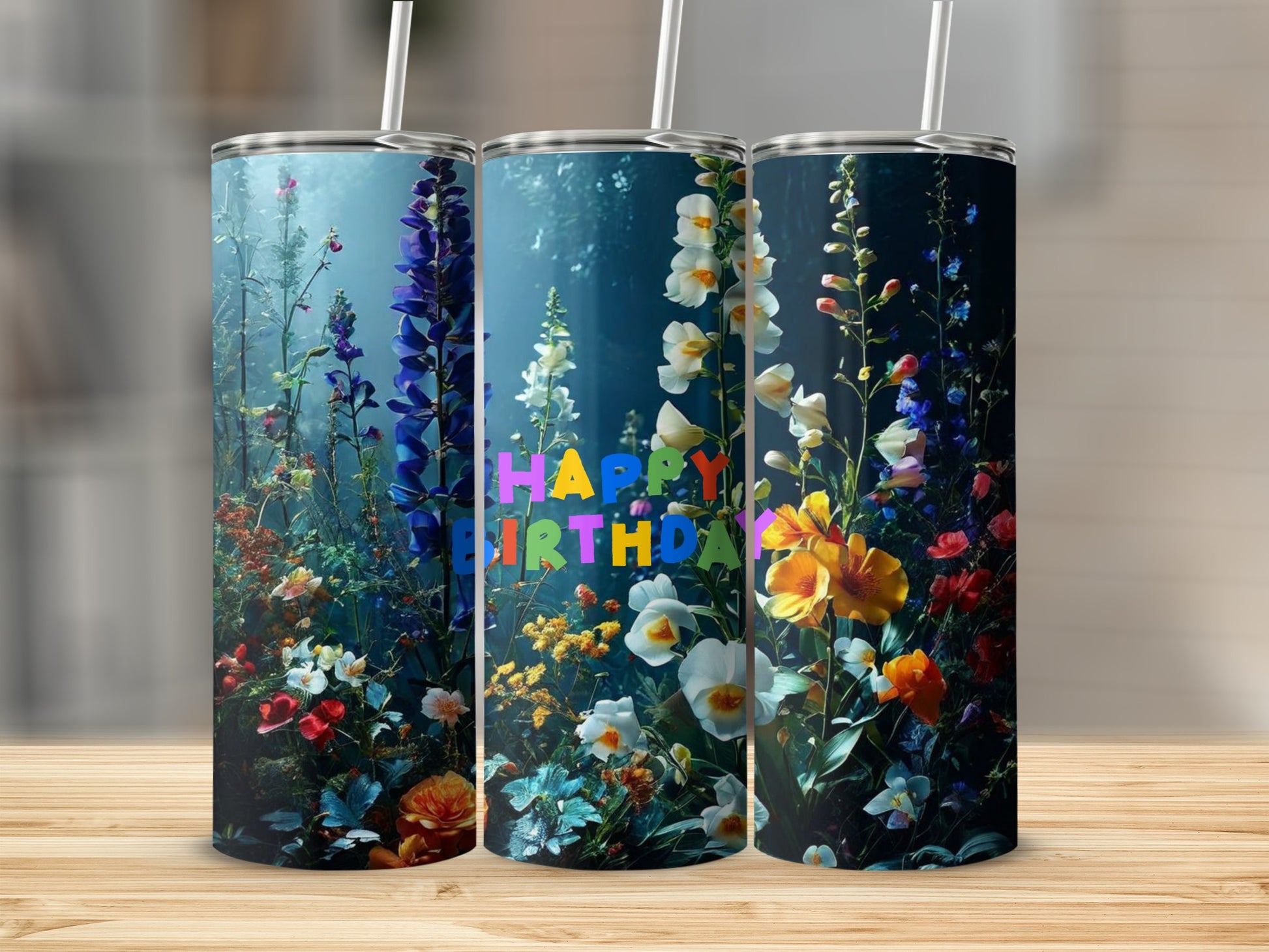 Three tumblers with "Happy Birthday" and floral designs.