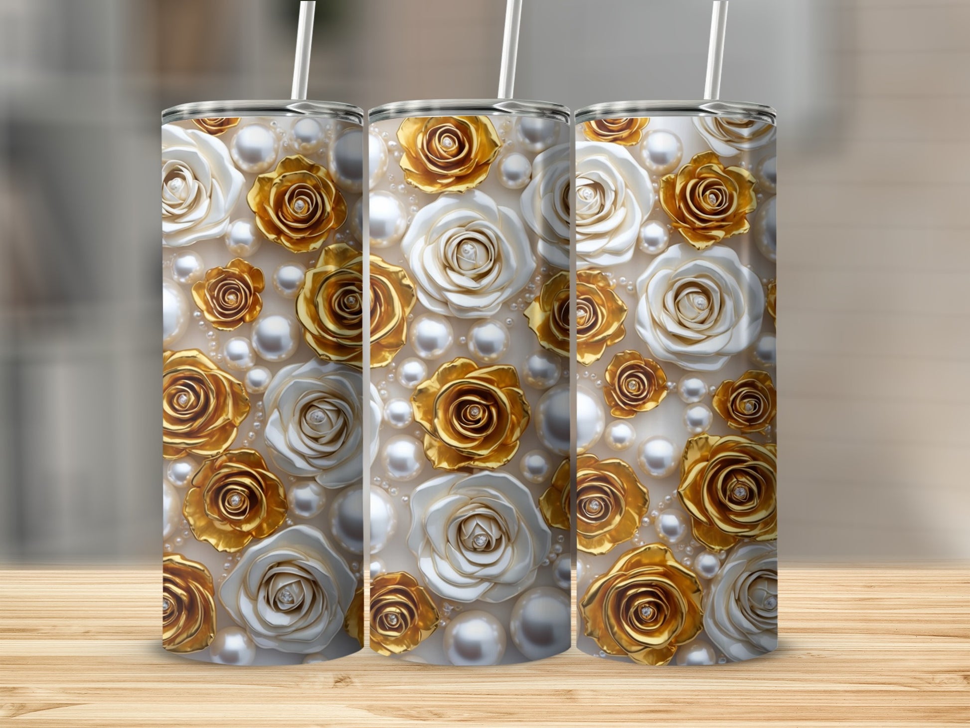 Three tumblers with a floral pattern of white and gold roses and pearls.