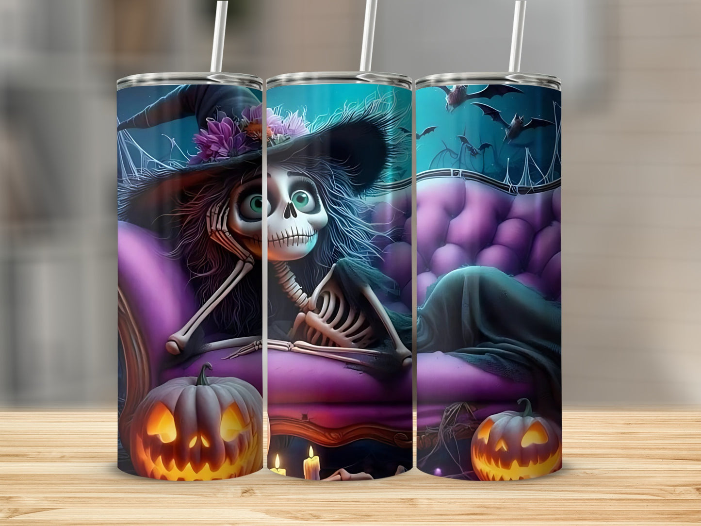 Skeleton witch on purple couch with pumpkins and bats on a tumbler.