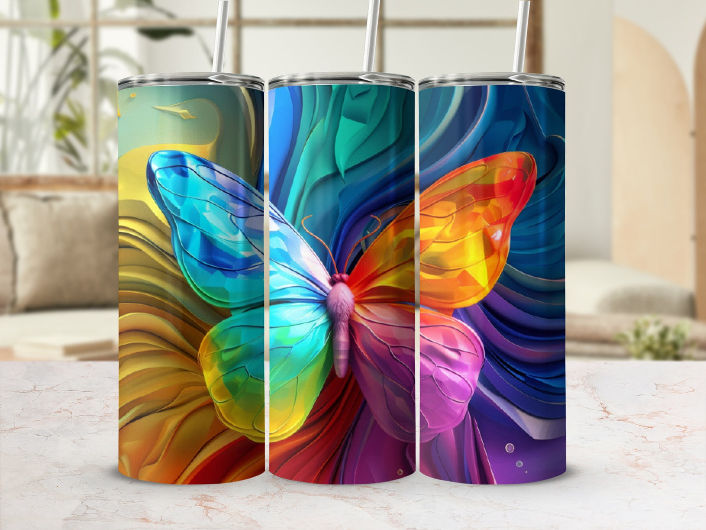 Three tumblers with vibrant, rainbow butterfly designs.