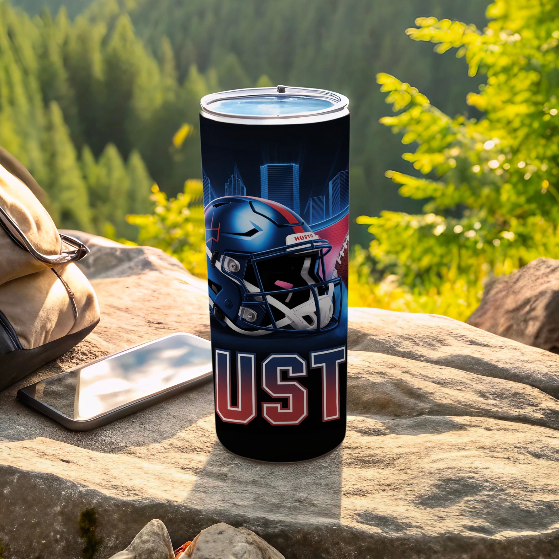 Football helmet and "UST" text on a black tumbler with city skyline.