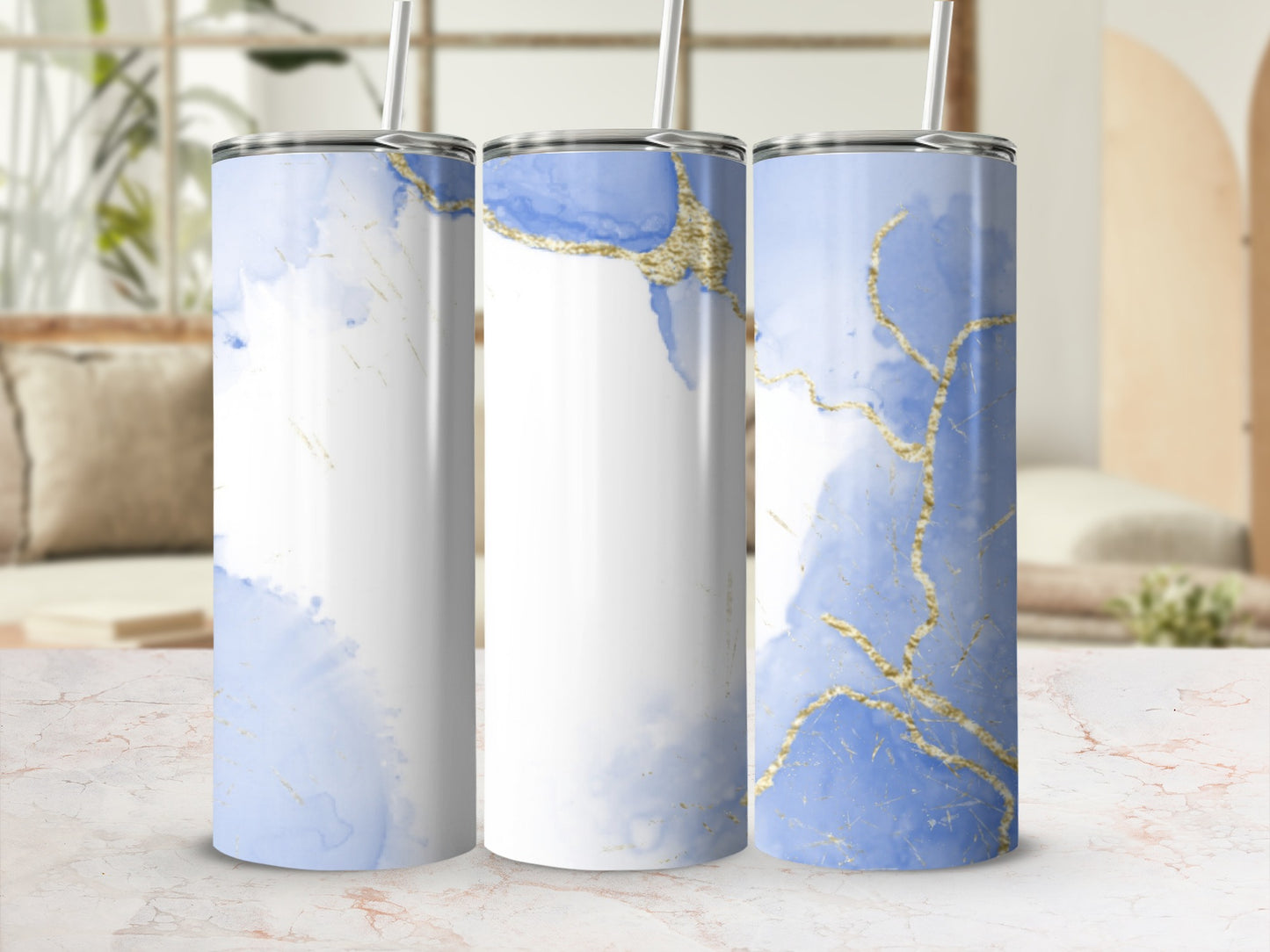 Three tumblers with a blue marble and gold abstract design.