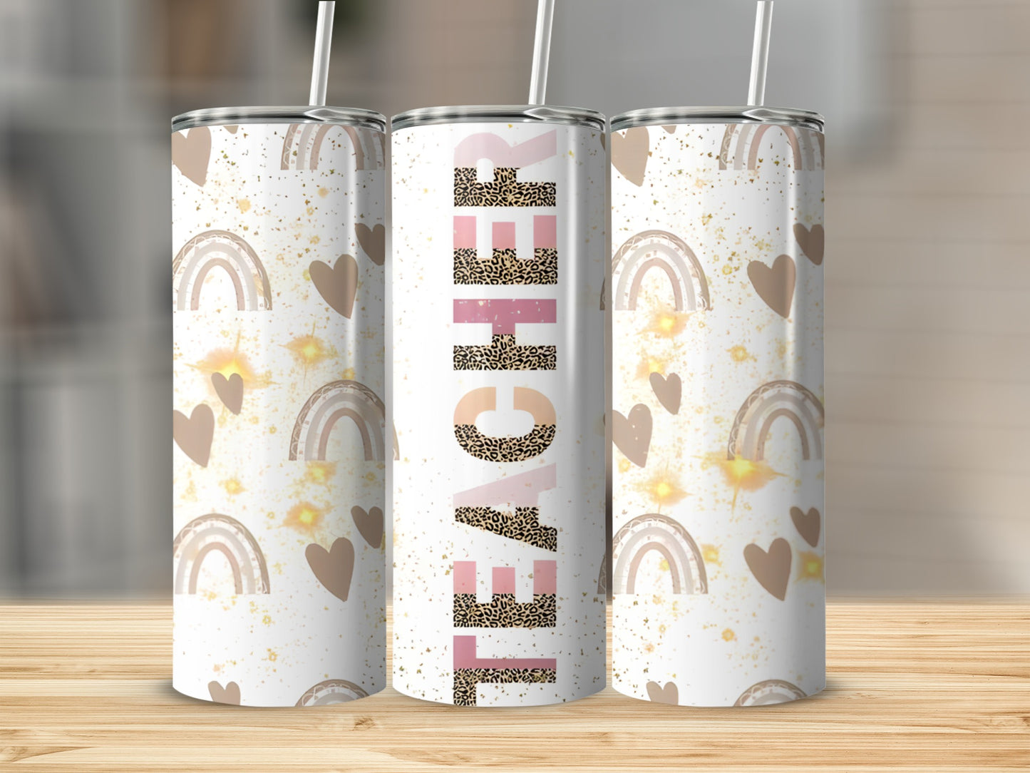 White tumbler with "Teacher" text, rainbows, hearts, and leopard print.