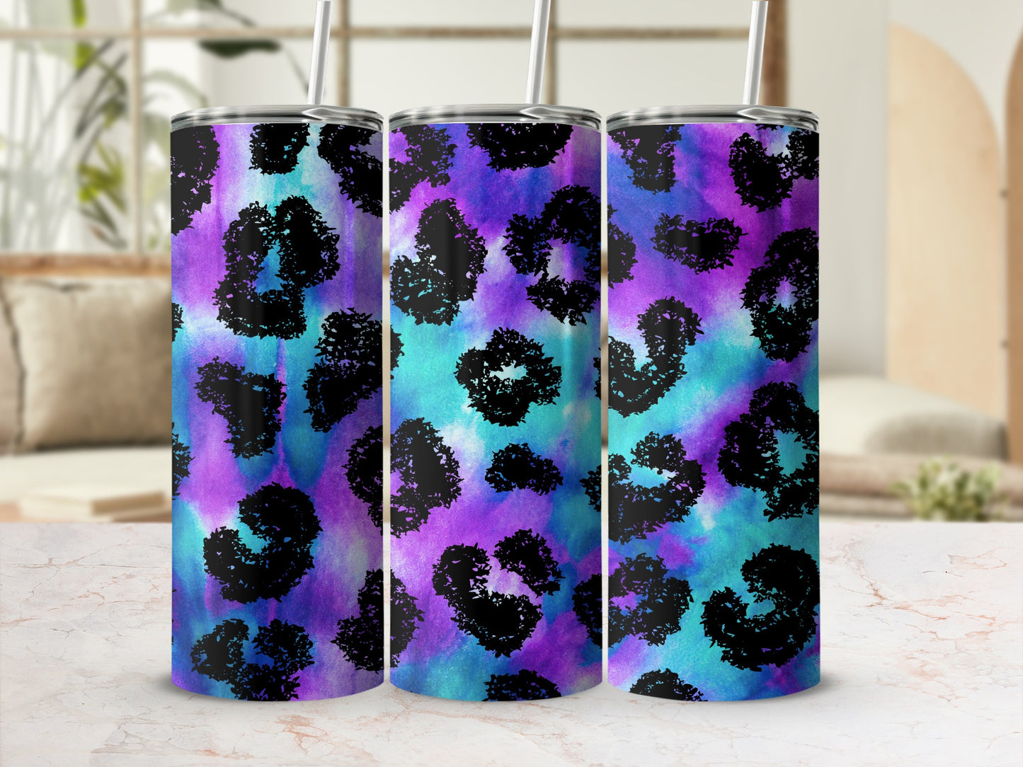 Three tumblers with a colorful watercolor leopard print design.