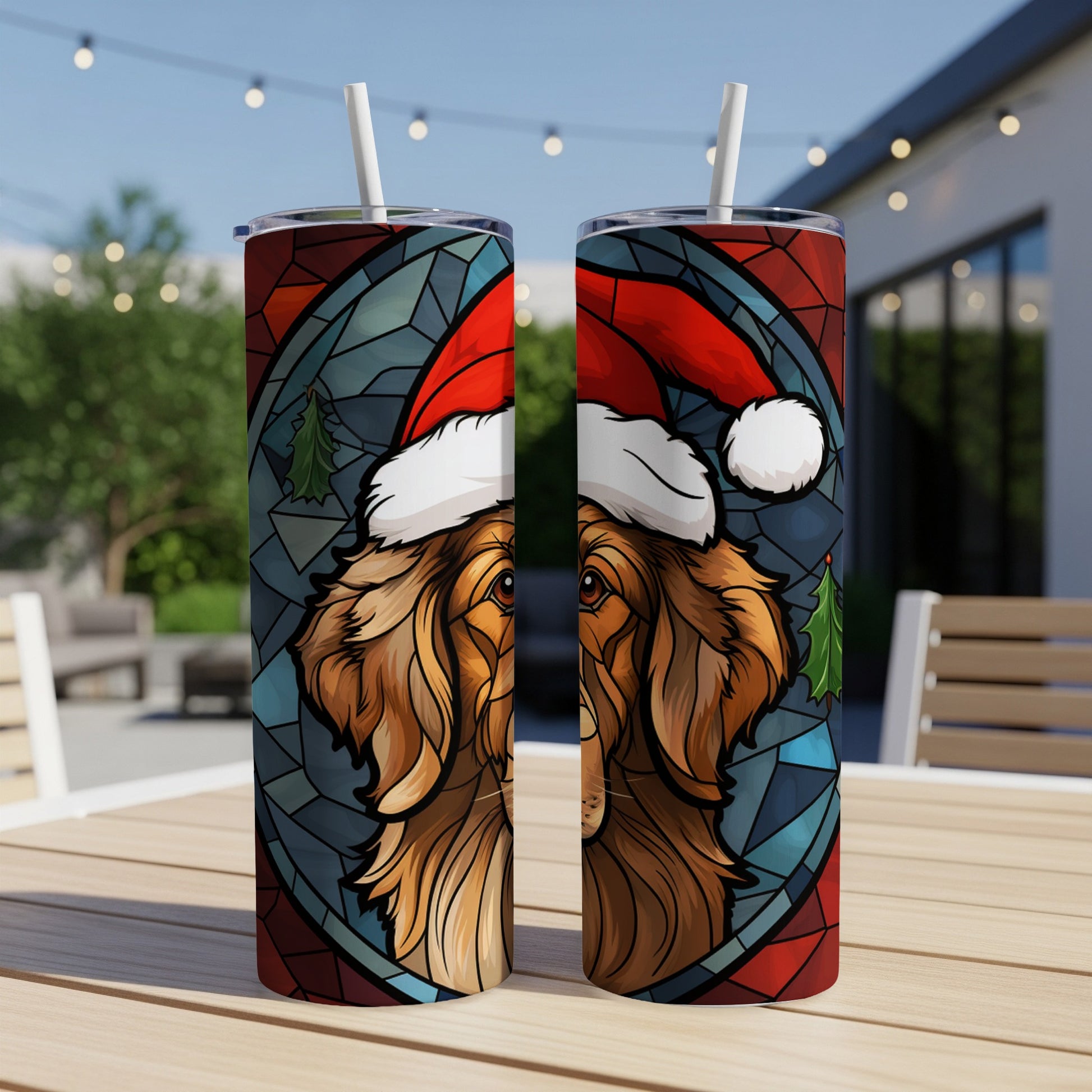 Golden retriever wearing Santa hat with stained glass and Christmas tree design on tumblers.