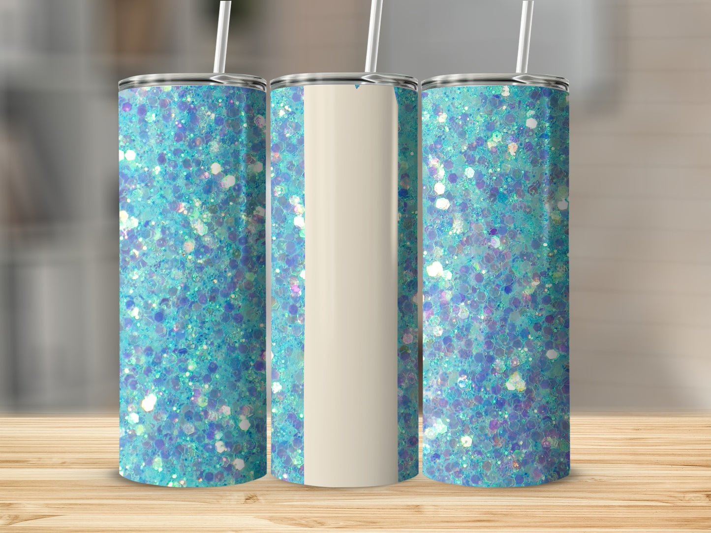 Three glitter tumblers with teal and purple sparkle on a wooden surface.