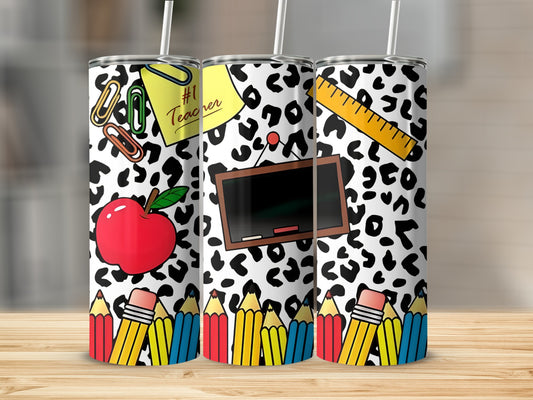 Leopard print tumbler with #1 Teacher apple, pencils, ruler, and chalkboard.