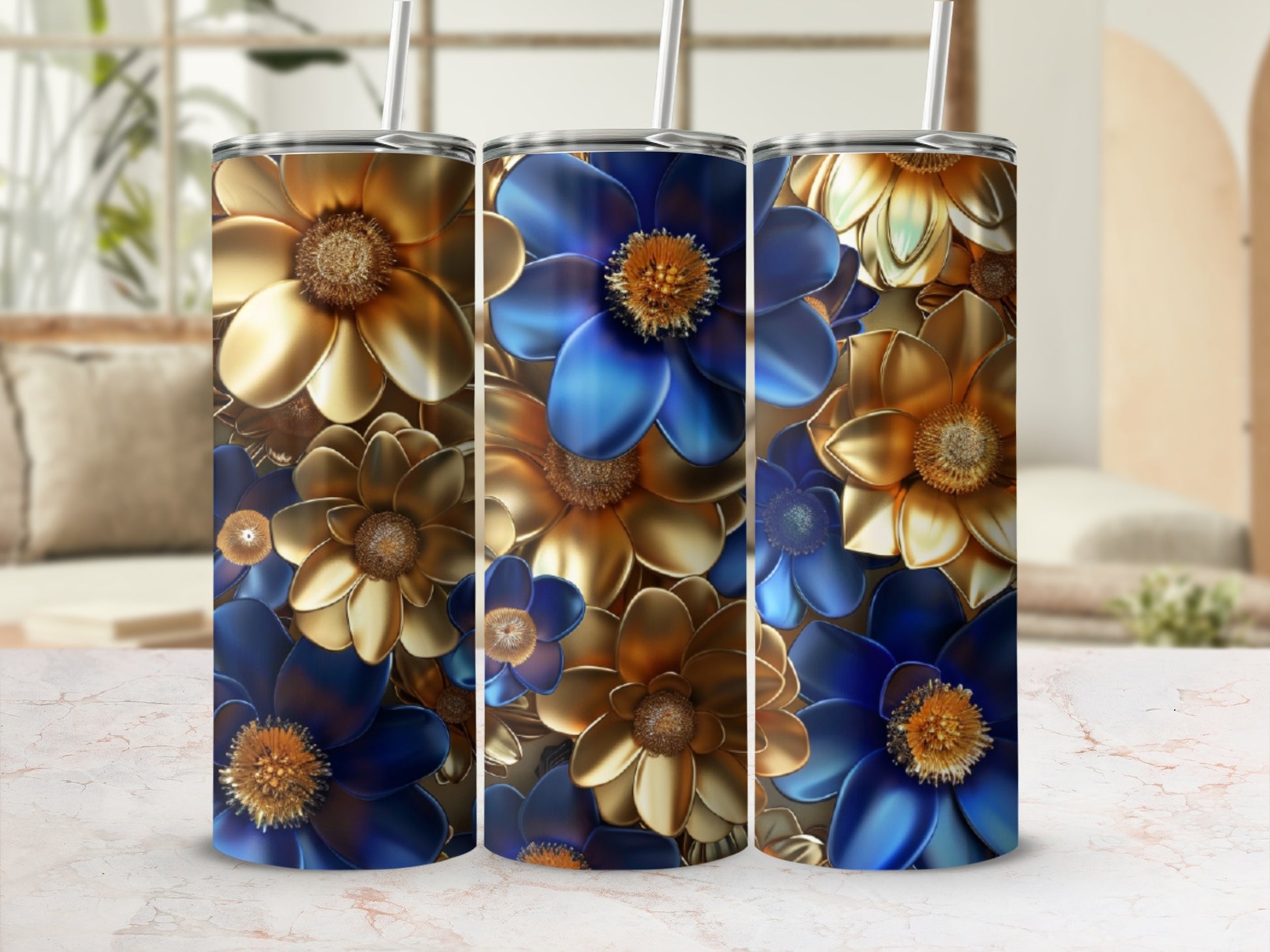 Three tall tumblers with metallic blue and gold floral designs.