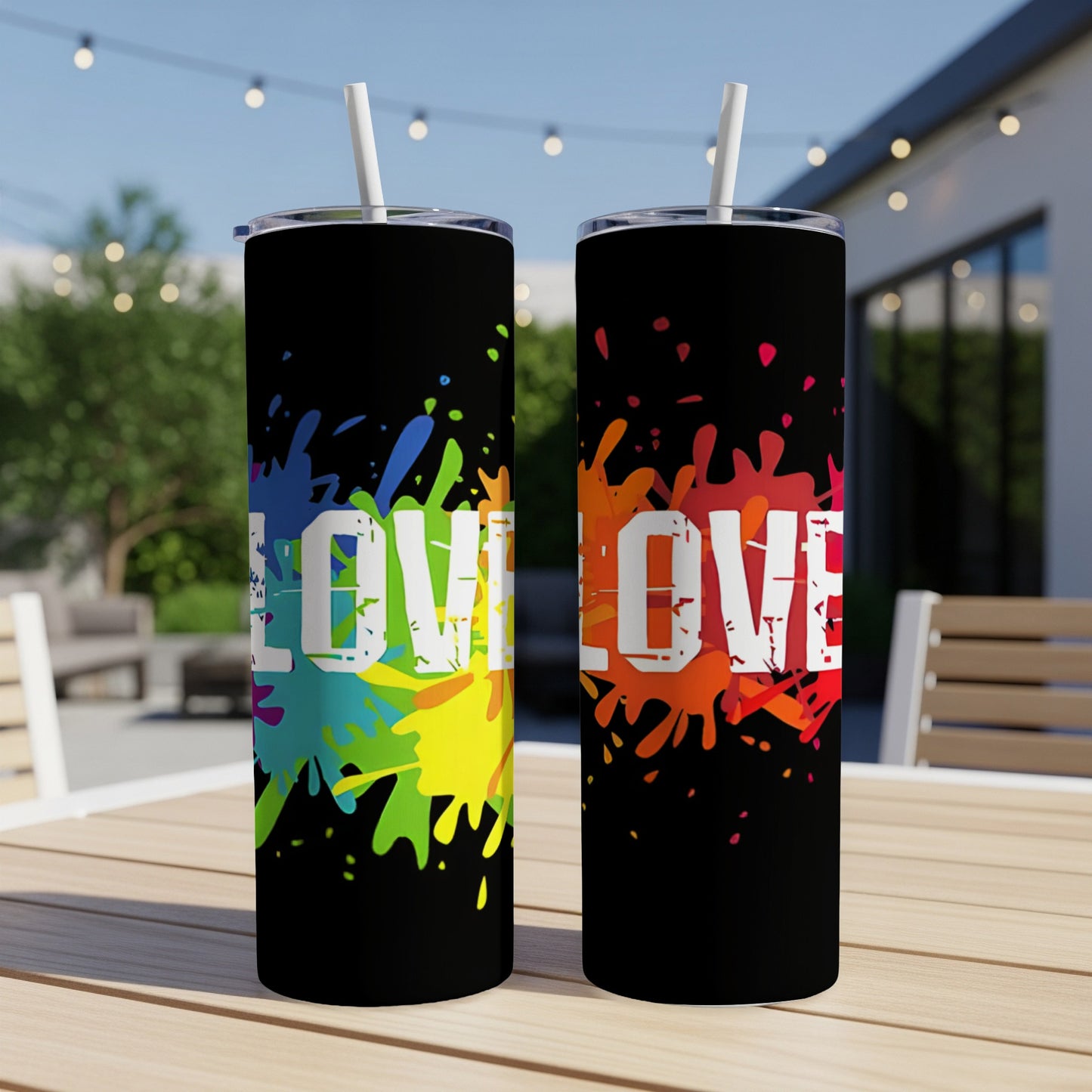 Two black tumblers with colorful paint splatters and the word "LOVE".