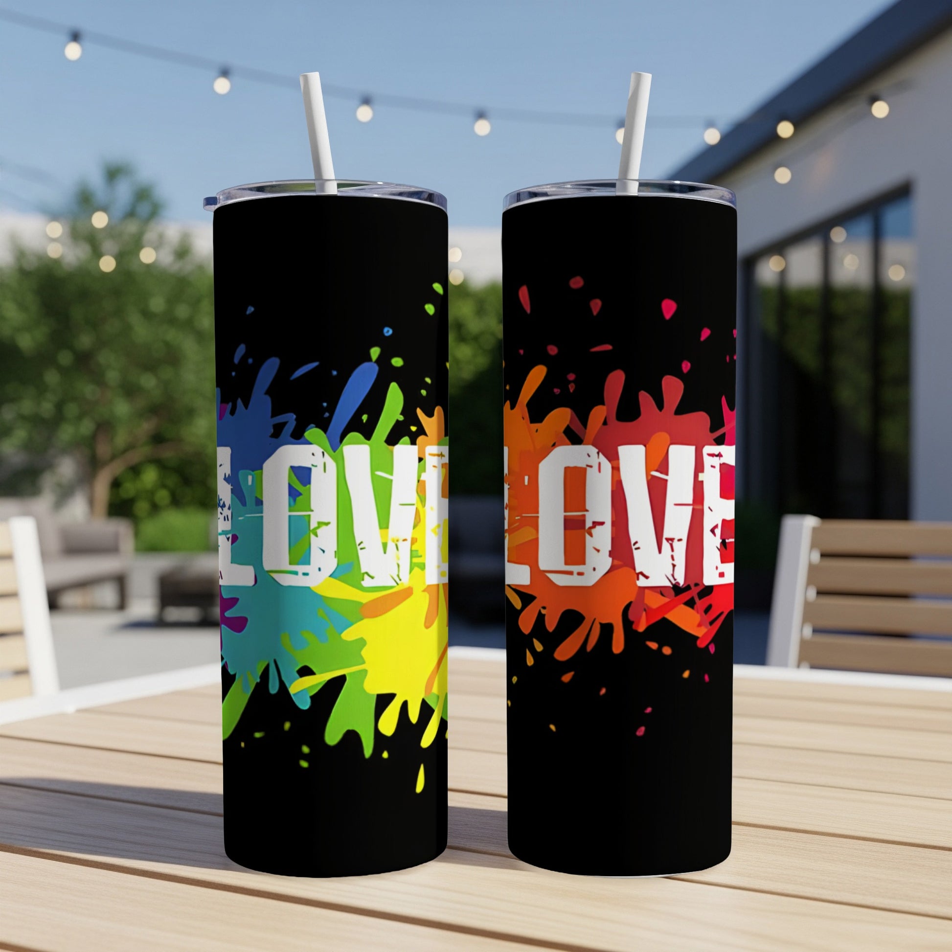 Two black tumblers with colorful paint splatters and the word "LOVE".