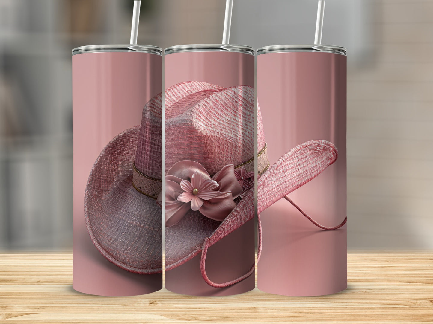 Pink glitter cowboy hat with floral embellishment on a tumbler.