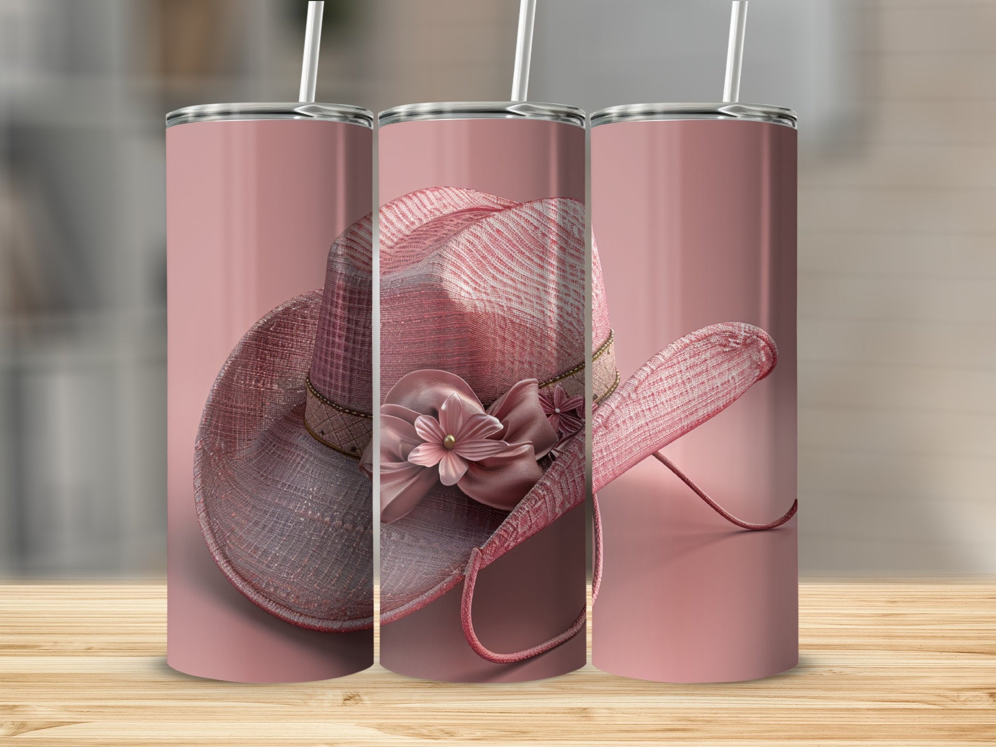 Pink glitter cowboy hat with floral embellishment on a tumbler.
