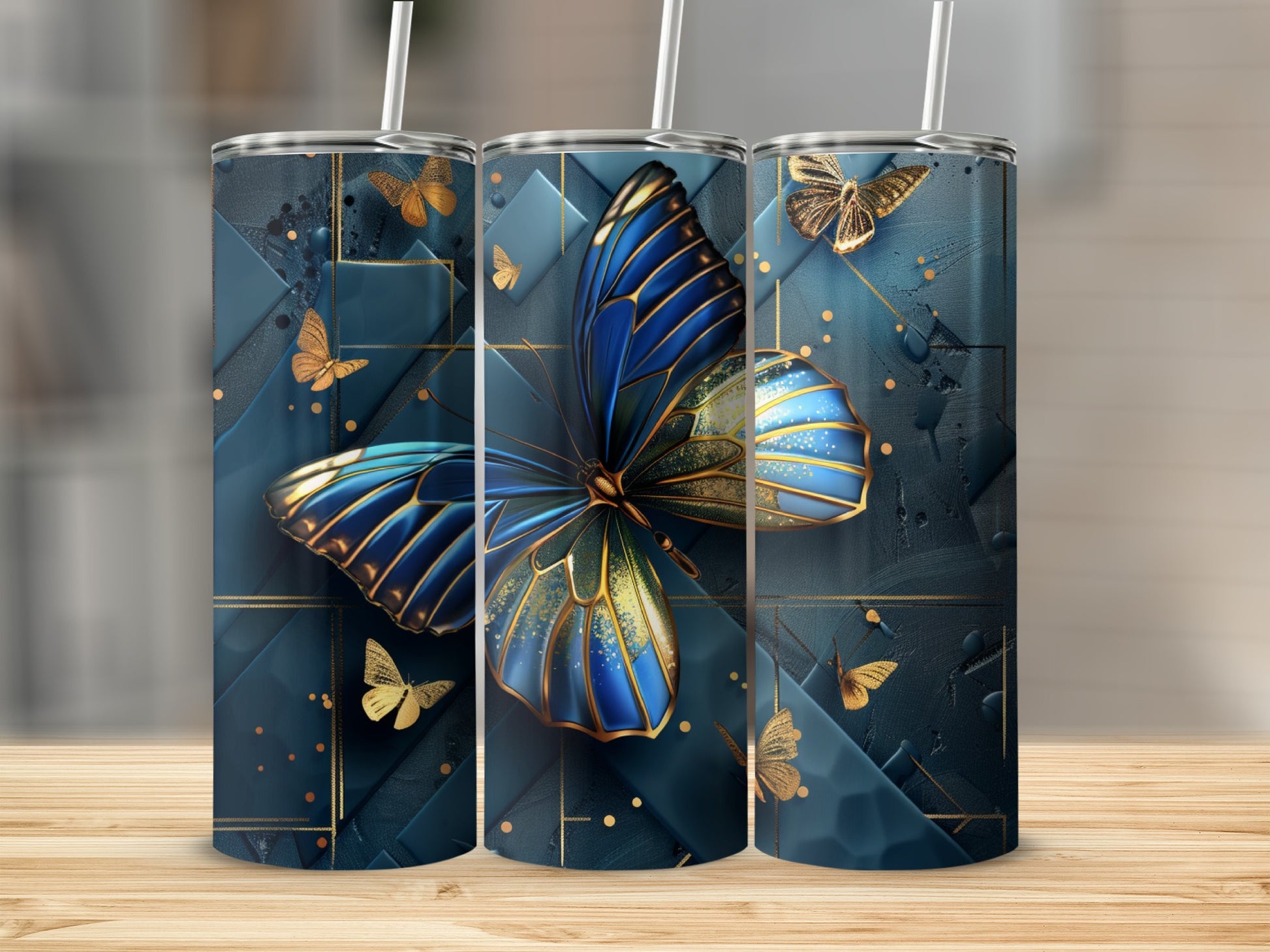 Three tumblers with a blue and gold butterfly design.