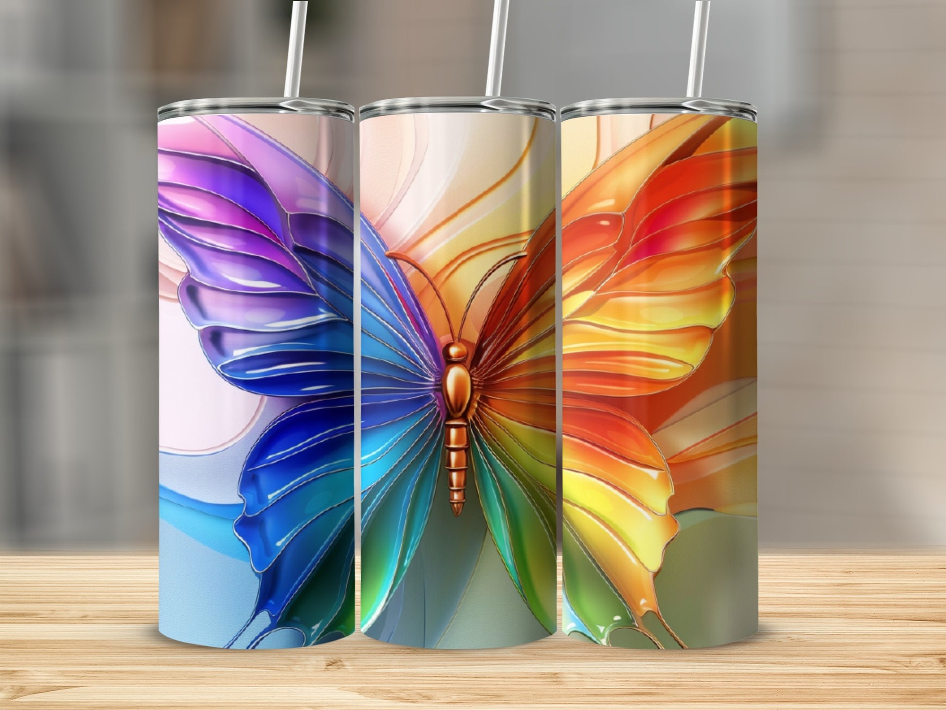 Three tumblers featuring a colorful stained-glass butterfly design.
