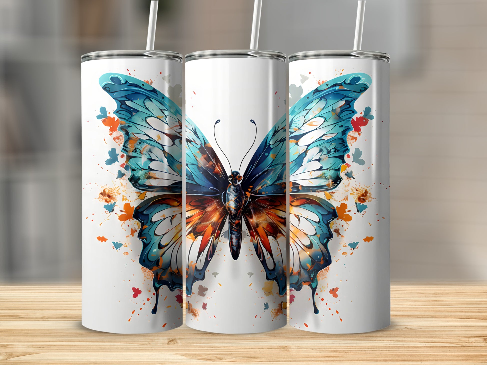 White tumblers with colorful butterfly design and splatter accents.