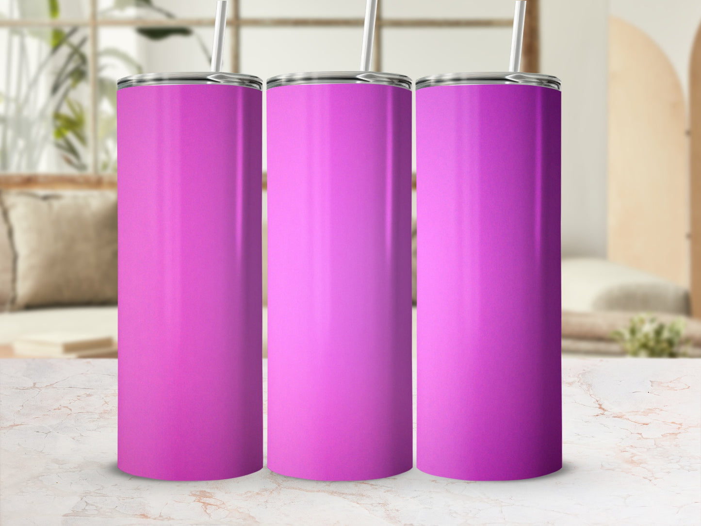 Three pink tumblers with straws on a marble surface.