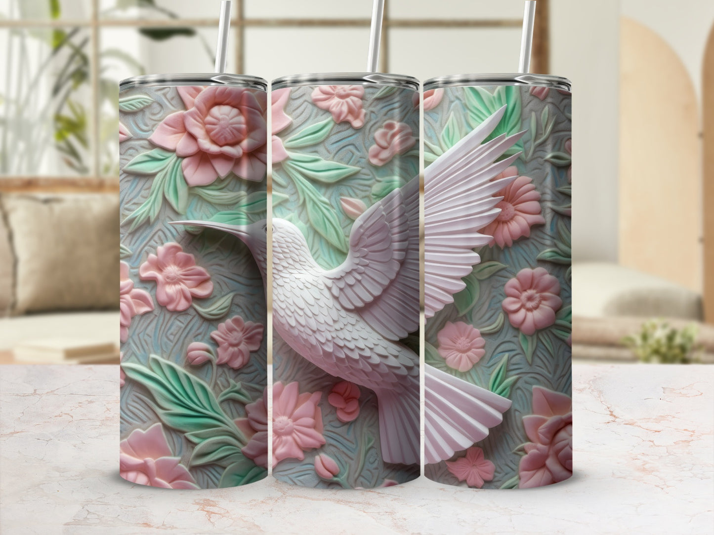 Three tumblers with a 3D embossed design of a white hummingbird and pink flowers.