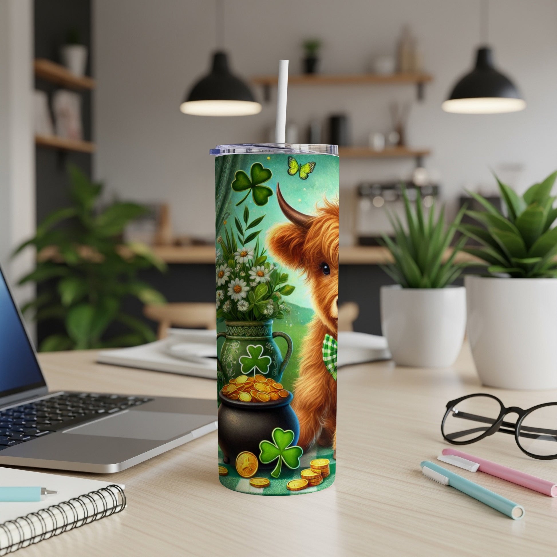 Highland cow with shamrocks and gold coins on a green tumbler.