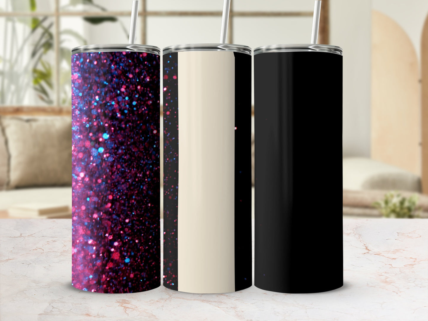 Three insulated tumblers: glitter, cream, and black, on a marble surface.