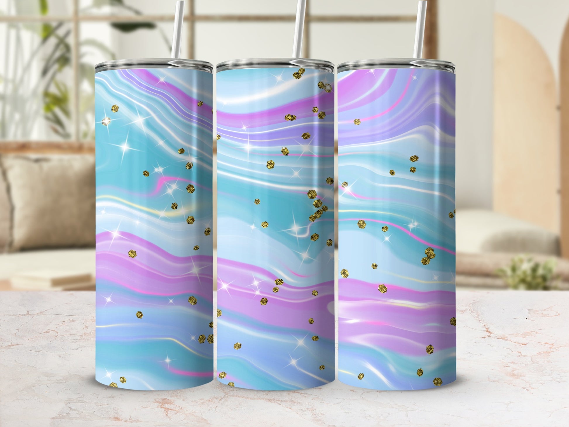 Three tumblers with a pastel tie-dye design and gold glitter accents.