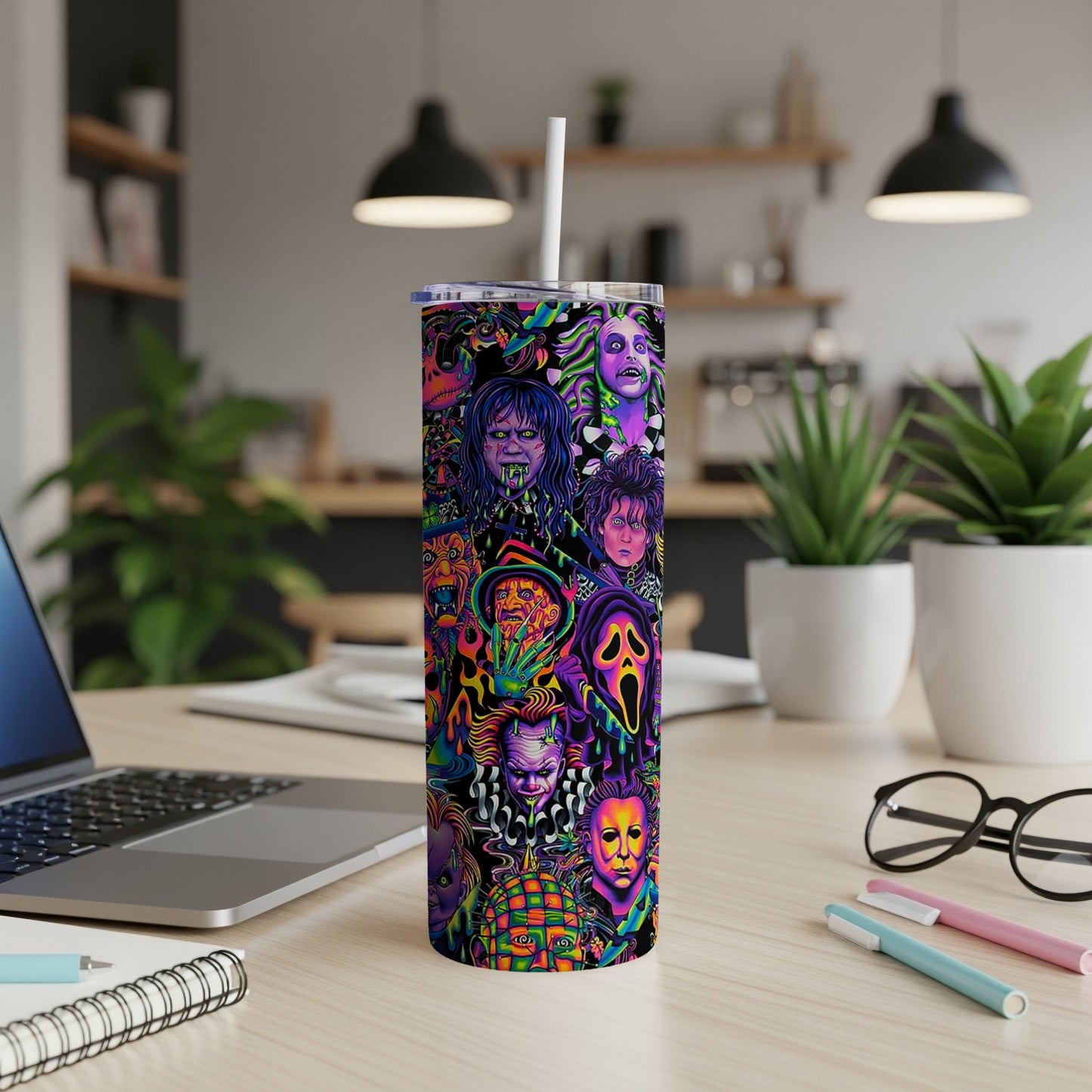 Tumbler with a collage of colorful horror movie characters.