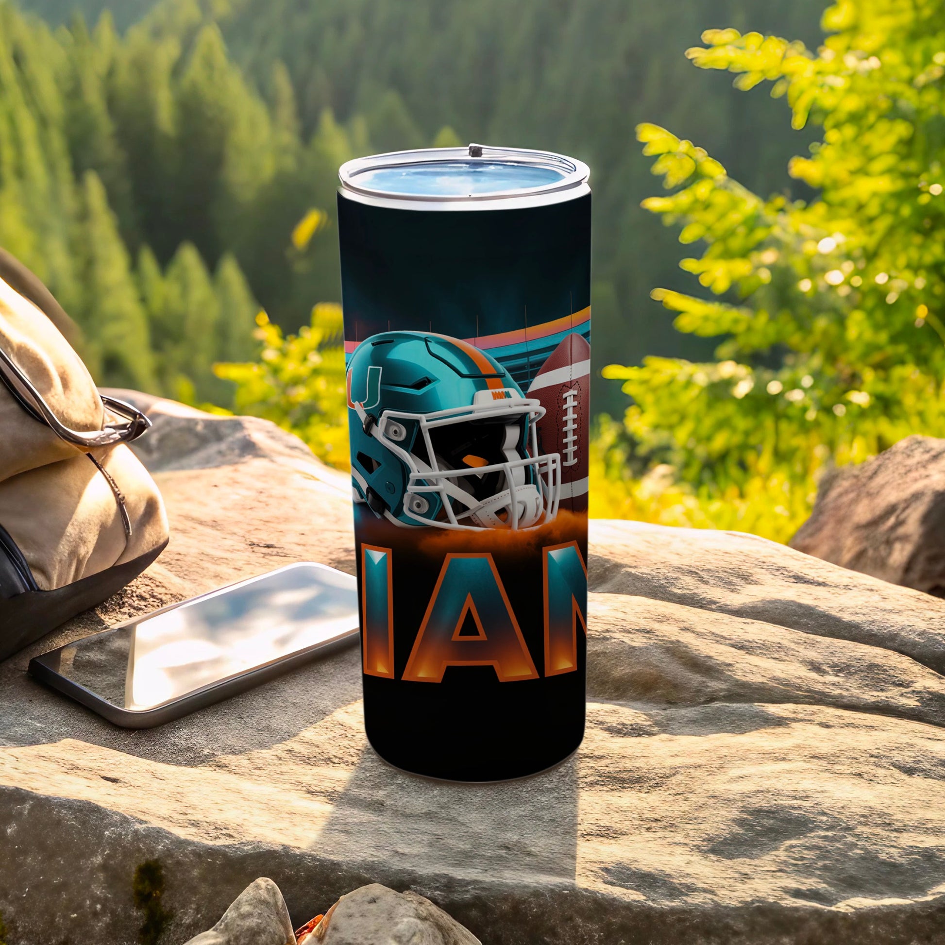 Miami Dolphins tumbler with team logo and football design.