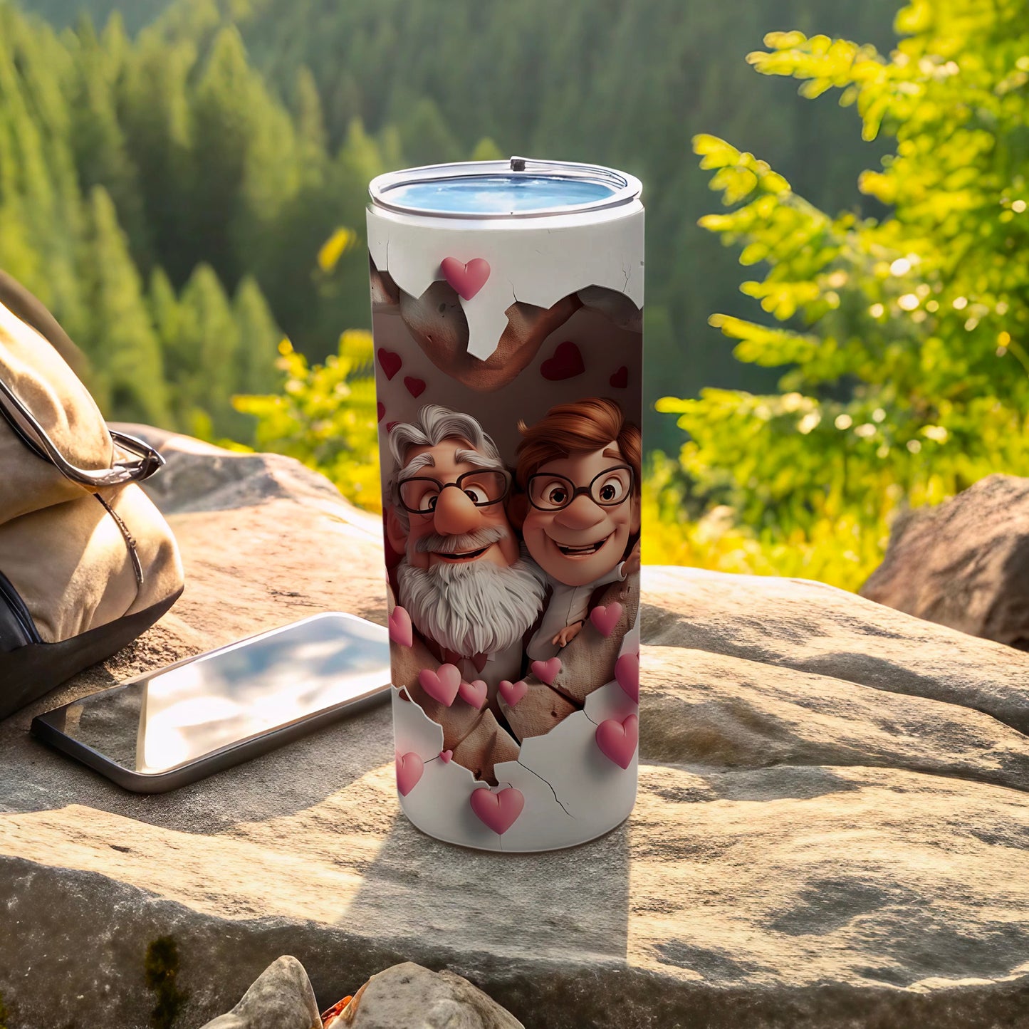 Tumbler with cartoon couple, hearts, and mountain background.
