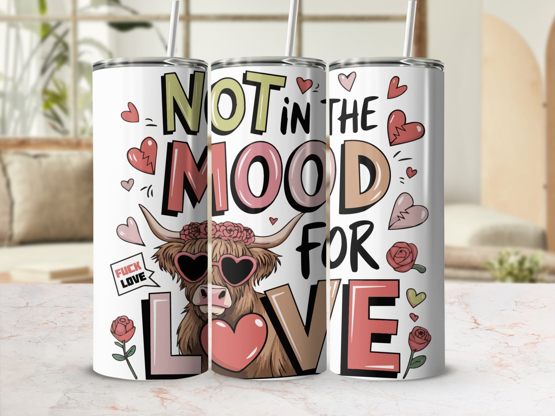 Holographic tumbler with "Not in the mood for love" and heart sunglasses.