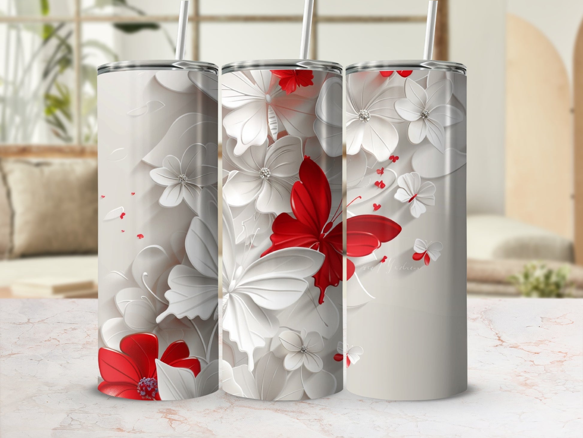 Three white tumblers with red and white butterflies and flowers.