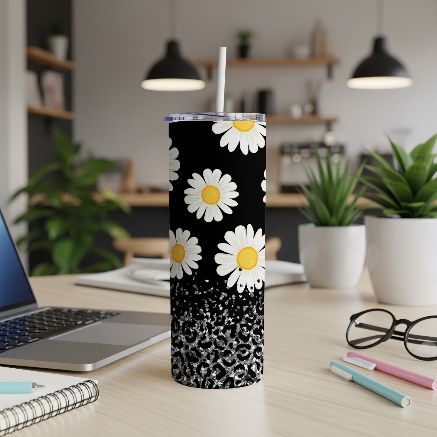 Black tumbler with white daisies and silver leopard print.