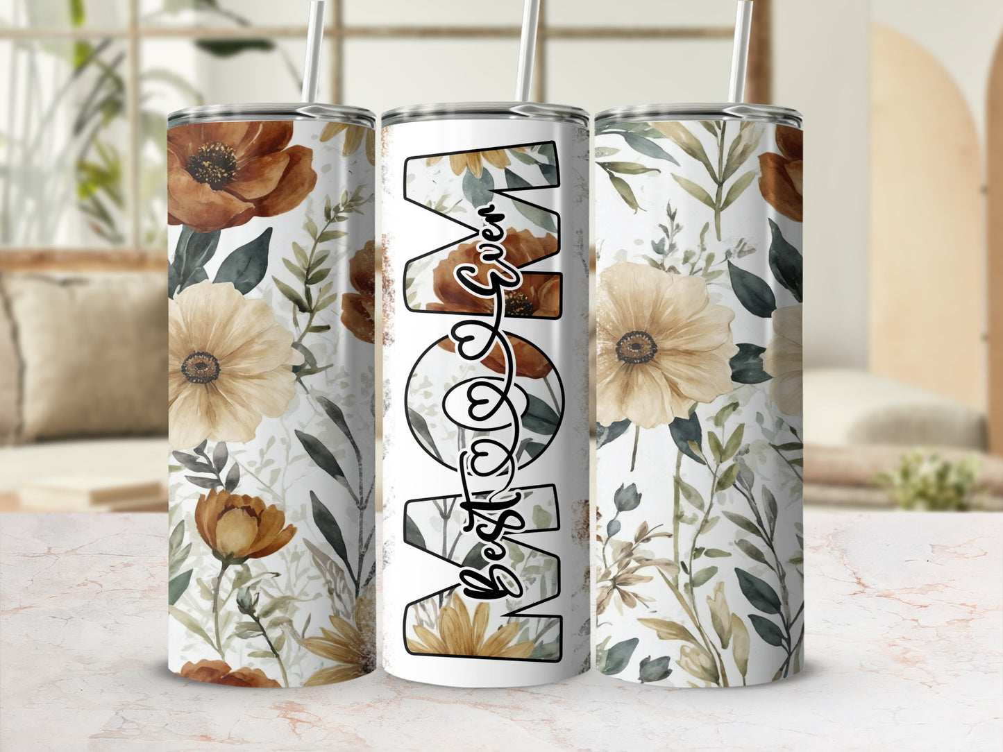 "Best Mom" text on a floral patterned tumbler with straw.