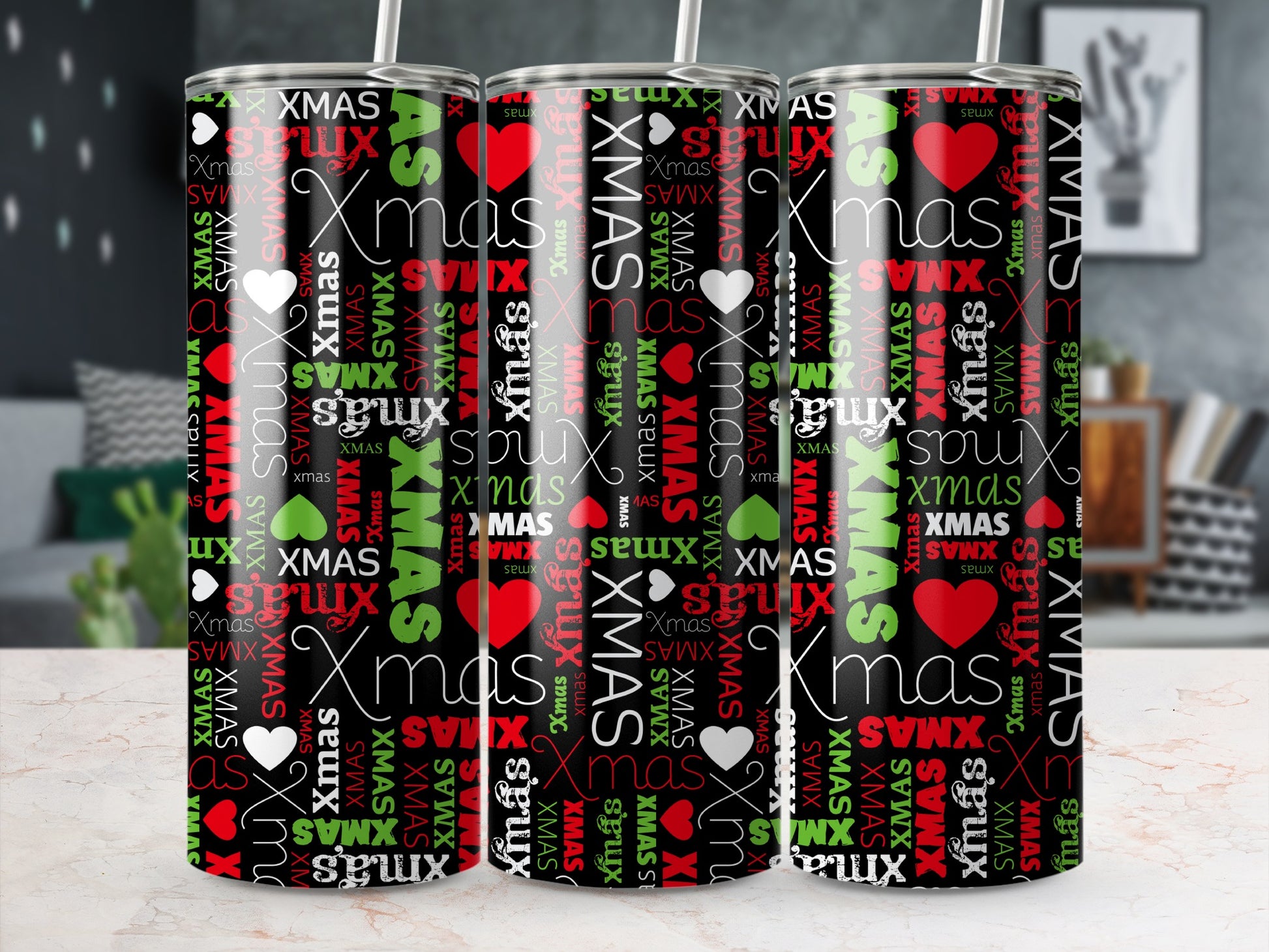 Tumbler with repeating "XMAS" text and heart graphic on a black background.