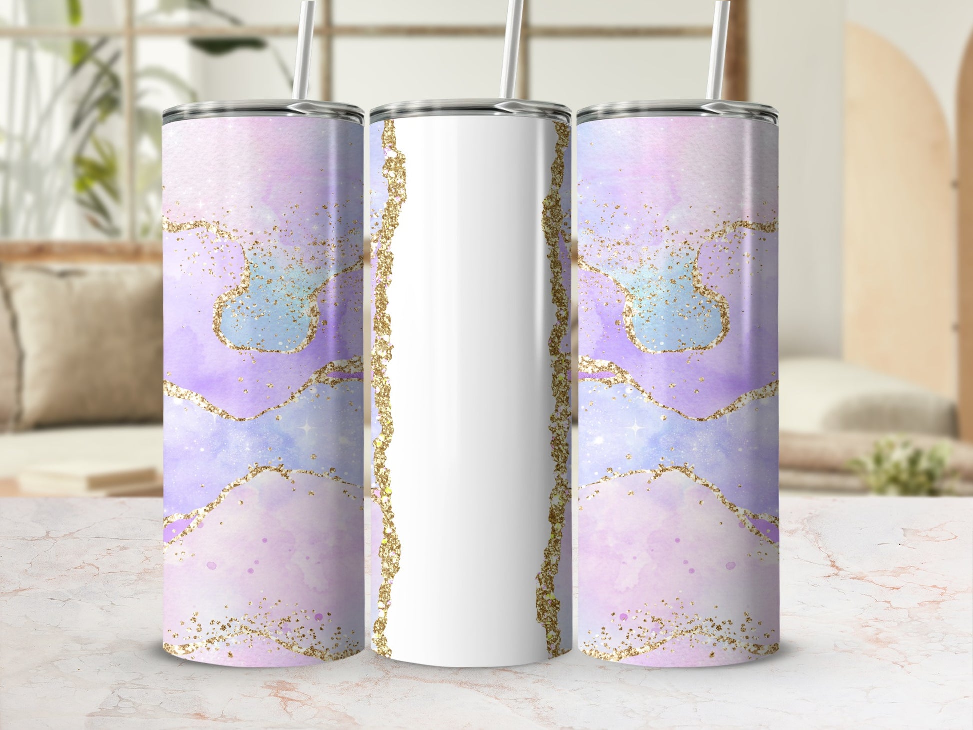 Three blank tumblers with watercolor and glitter designs.