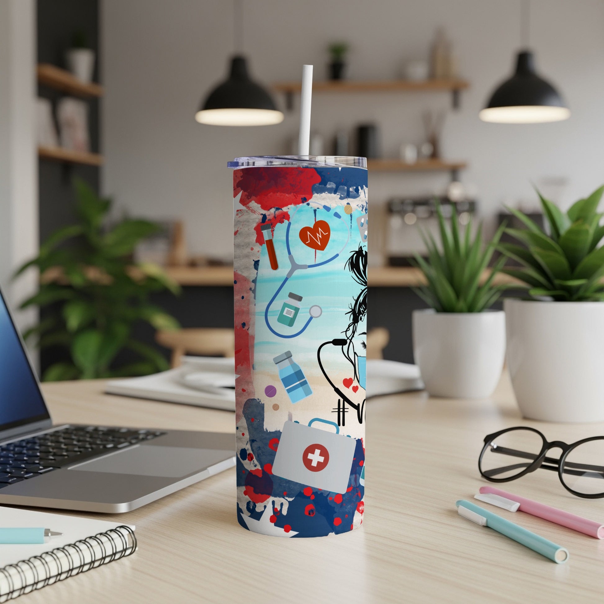 Tumbler with medical icons, stethoscope, and splash paint design.