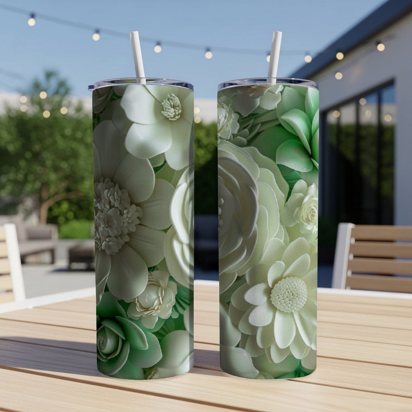 Two tumblers with a floral pattern of light green and white flowers.