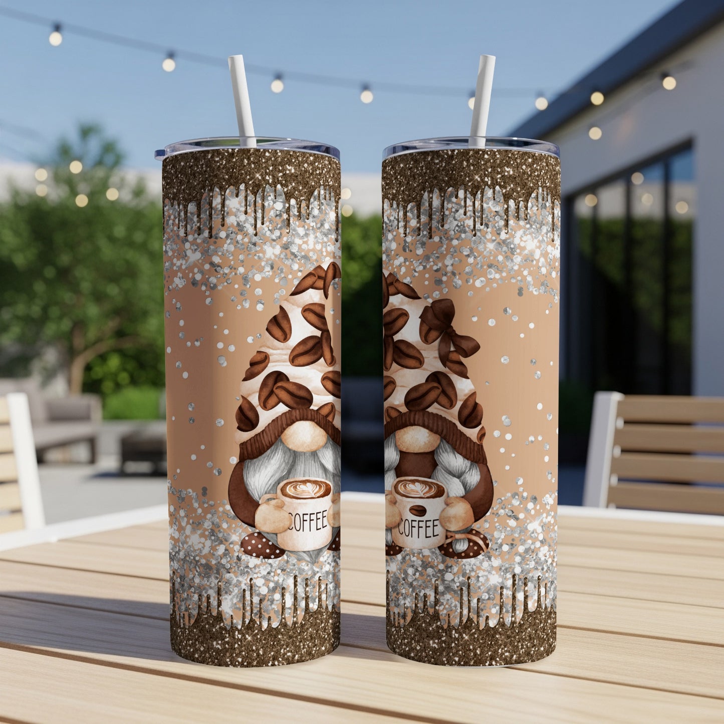 Two tumblers with coffee gnome design and glitter drip on a table.