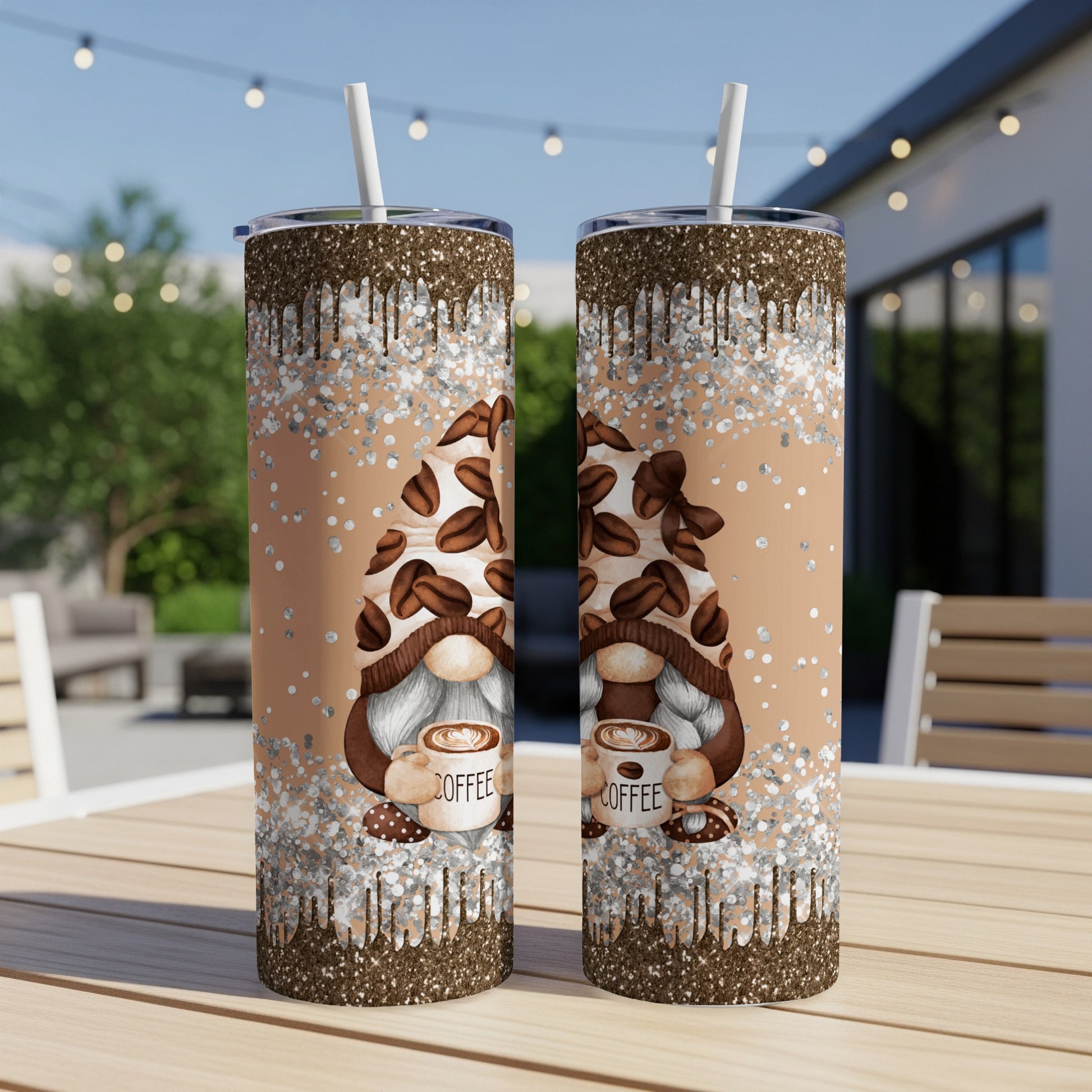 Two tumblers with coffee gnome design and glitter drip on a table.