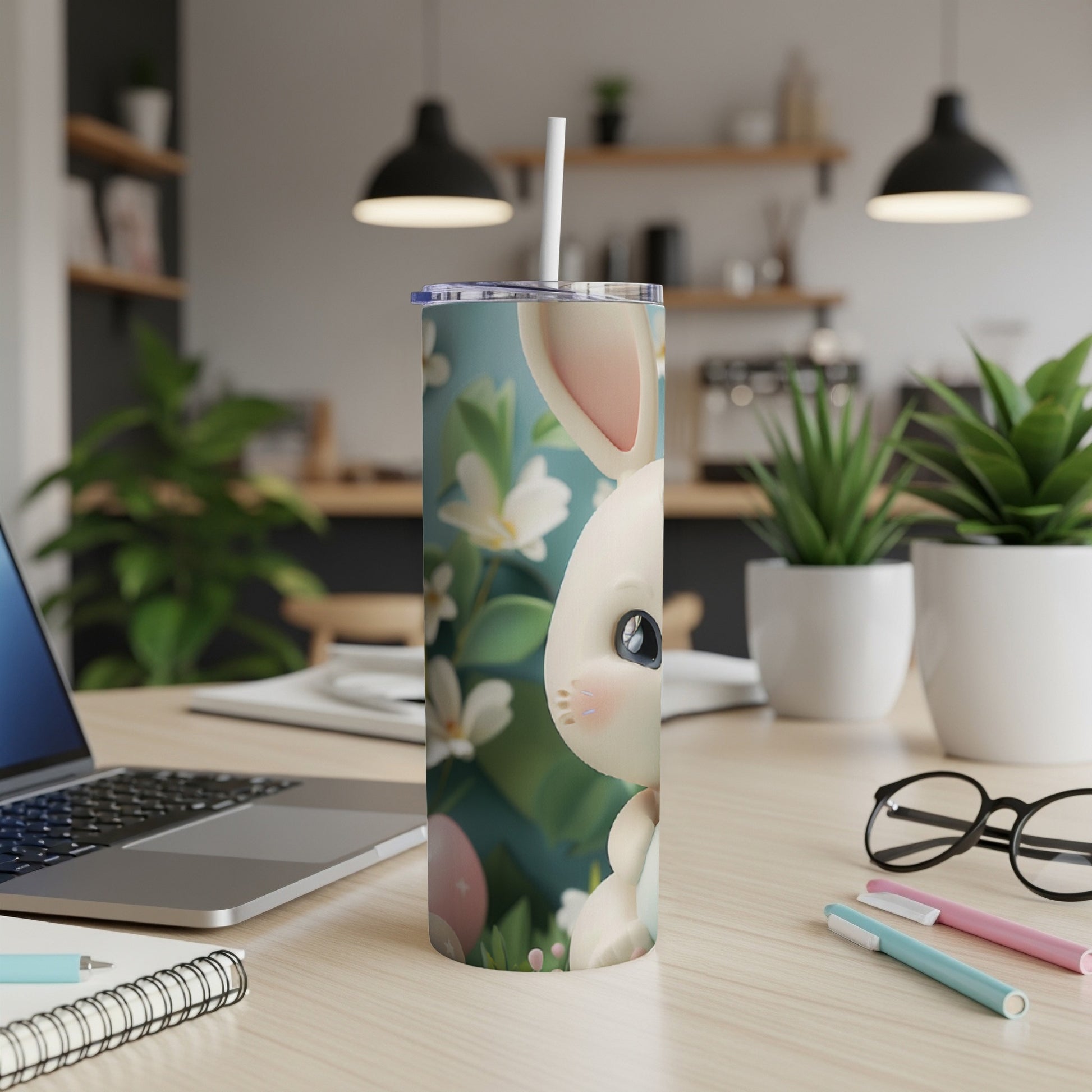 White Easter bunny tumbler with pastel flowers and Easter eggs.