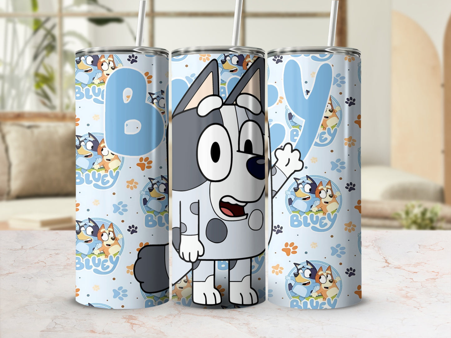 Bluey and Bingo cartoon characters on a light blue patterned tumbler.