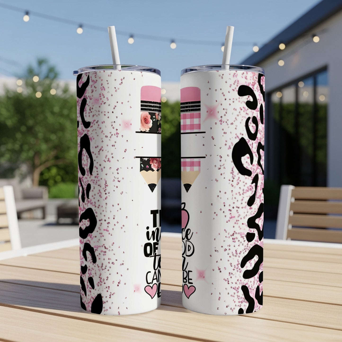 Two tumblers with leopard print, pink glitter, and pencil designs.