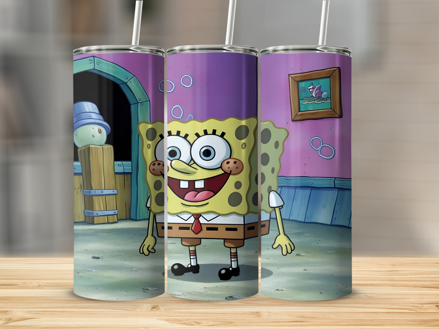 SpongeBob SquarePants character on three tumblers with a wooden background.