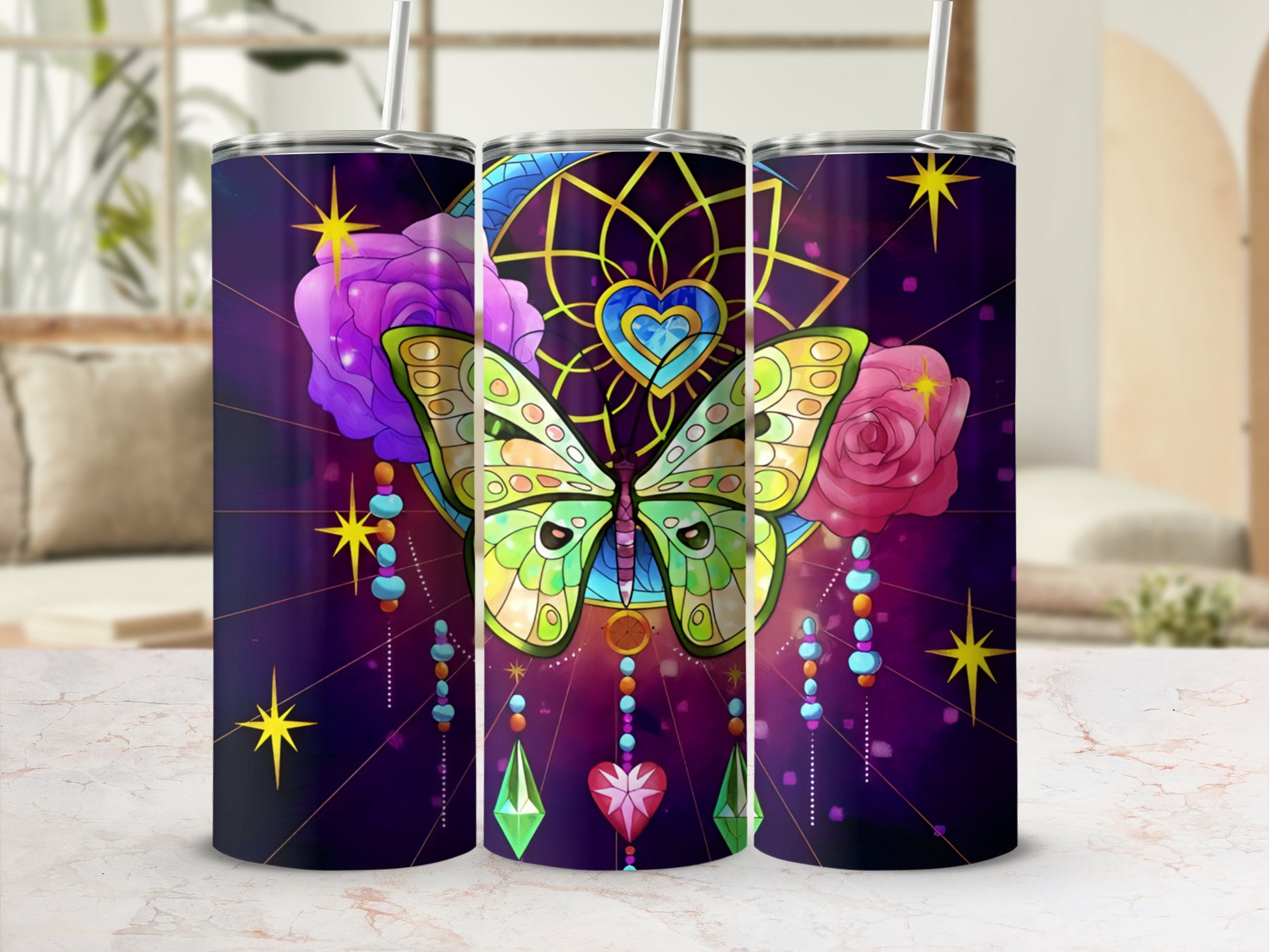 Butterfly and dreamcatcher design on three tumblers with straw.